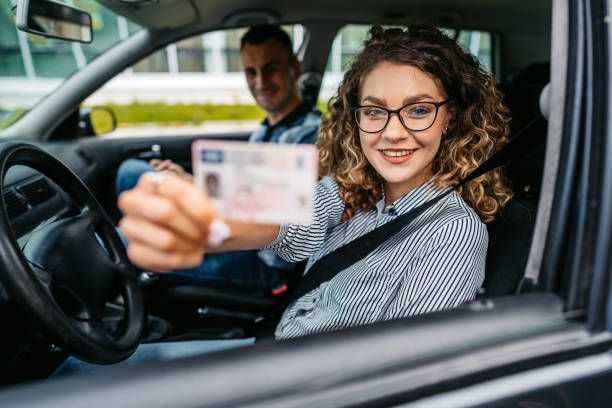 A joyful girl celebrating the achievement of receiving her driving license